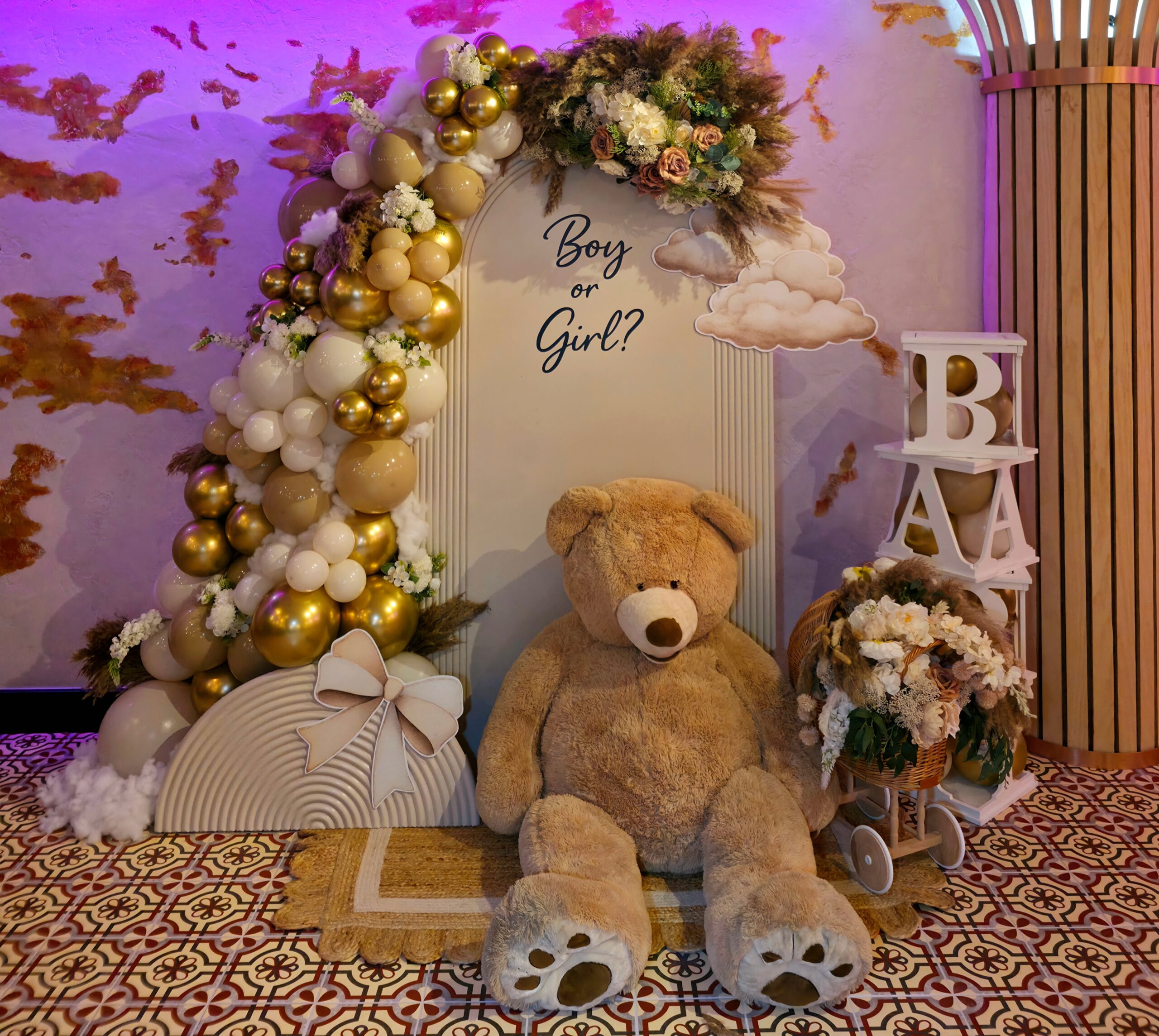 Neutral gender reveal balloon arch with pampas florals and teddy bear styling at Lawin Kitchen Enfield